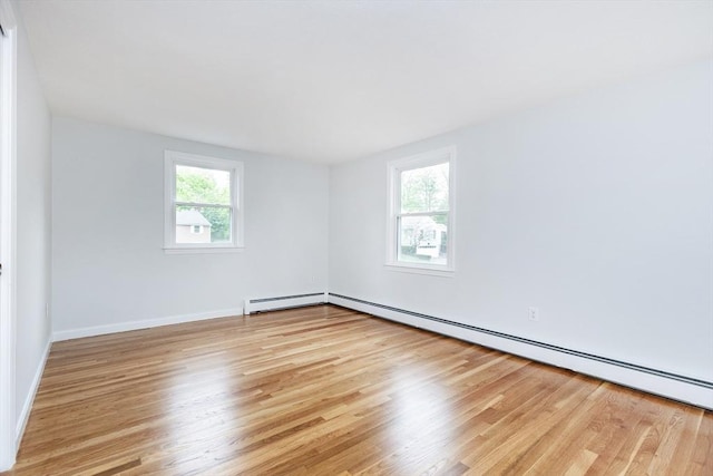 6 Post Gate Rd, Danvers, MA 01923 - spare room with plenty of natural light, wood finished floors, a baseboard radiator, and baseboards