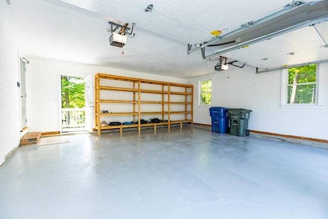 6 Post Gate Rd, Danvers, MA 01923 - garage featuring a garage door opener and baseboards