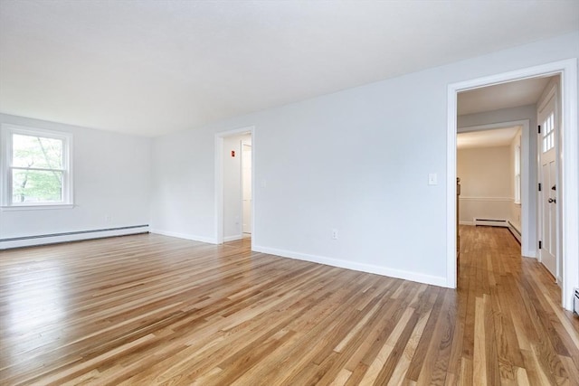 6 Post Gate Rd, Danvers, MA 01923 - unfurnished room featuring baseboard heating, light wood-type flooring, and baseboards