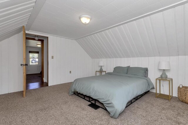 carpeted bedroom with vaulted ceiling