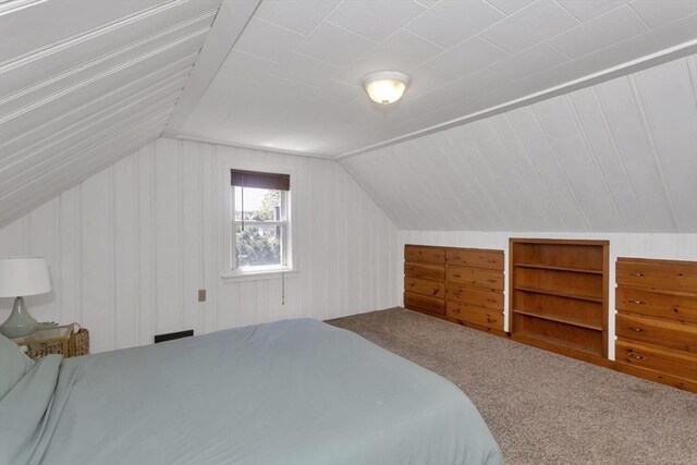 carpeted bedroom with vaulted ceiling