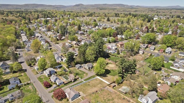 birds eye view of property featuring a residential view and a forest view