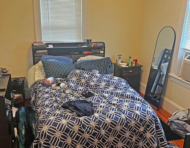 bedroom with hardwood / wood-style flooring