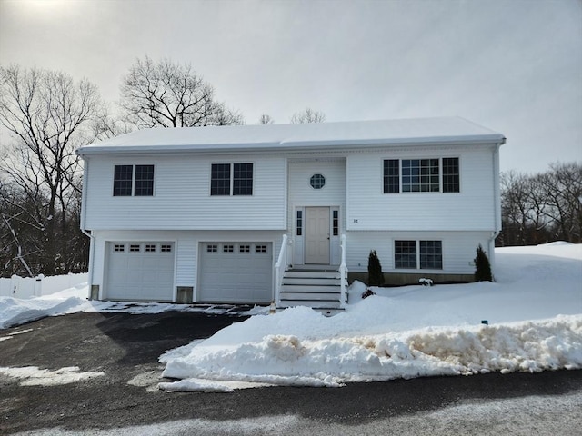 split foyer home with a garage and driveway