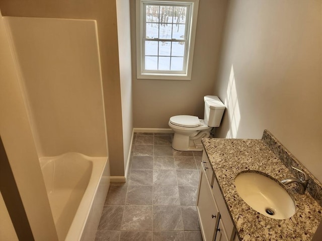 bathroom featuring toilet, vanity, baseboards, a bath, and walk in shower