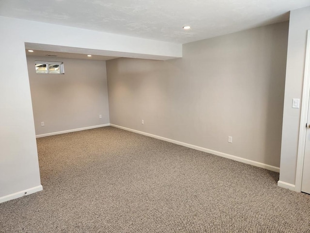 finished below grade area featuring recessed lighting, carpet flooring, and baseboards