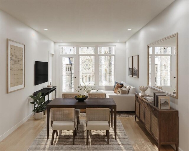 living area featuring recessed lighting, baseboards, and light wood finished floors