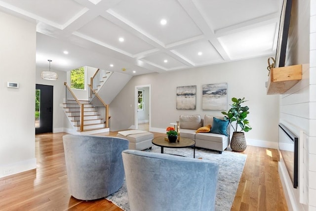 66 Upham St, Newton, MA 02465 - living area with coffered ceiling, baseboards, stairway, light wood-style flooring, and recessed lighting