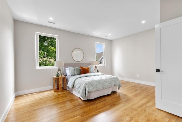 66 Upham St, Newton, MA 02465 - bedroom with multiple windows, light wood-type flooring, baseboards, and recessed lighting