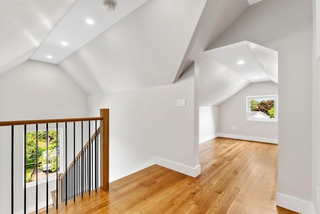 66 Upham St, Newton, MA 02465 - bonus room featuring lofted ceiling, recessed lighting, baseboards, and light wood finished floors