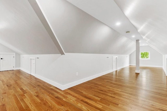 66 Upham St, Newton, MA 02465 - additional living space featuring vaulted ceiling, light wood-type flooring, and baseboards