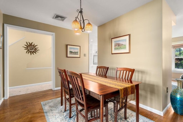 17 Angela Ln Unit 17, Watertown, MA 02472 - dining room featuring wood finished floors, baseboards, and a chandelier