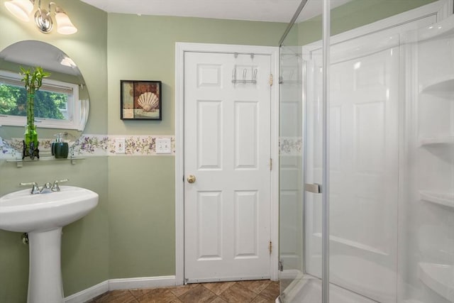 55 W 3rd St Unit 3, Lowell, MA 01850 - bathroom with a shower stall, baseboards, and a sink