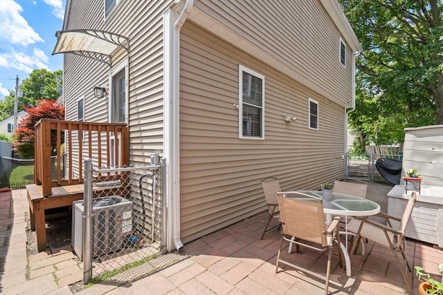 55 W 3rd St Unit 3, Lowell, MA 01850 - view of patio / terrace featuring central AC unit, outdoor dining area, and a gate