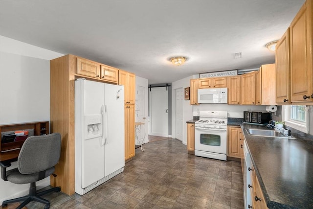 55 W 3rd St Unit 3, Lowell, MA 01850 - kitchen with white appliances, a sink, dark countertops, and a desk