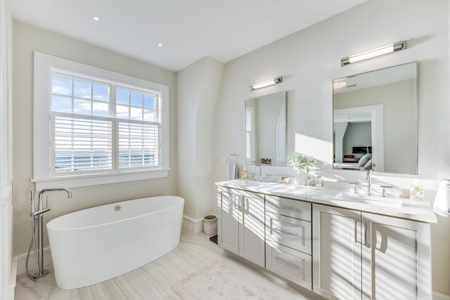 bathroom featuring vanity and a bathing tub