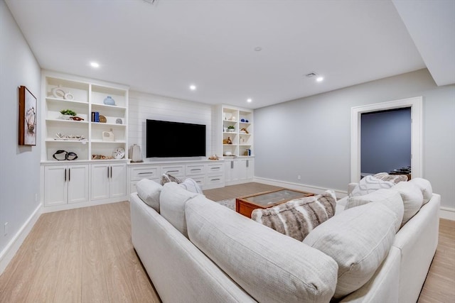 living room with light hardwood / wood-style flooring