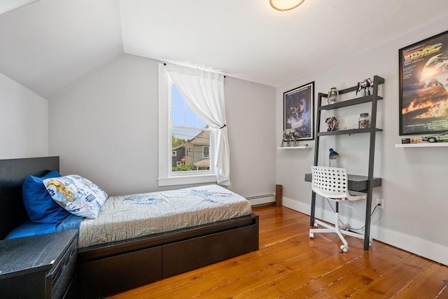 37 Devereux St, Marblehead, MA 01945 - bedroom featuring wood-type flooring, vaulted ceiling, and baseboard heating