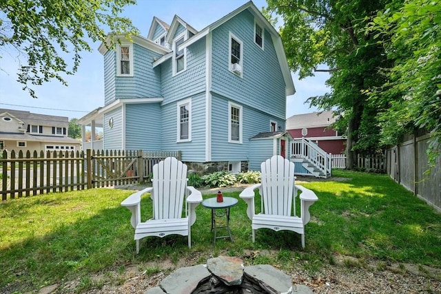 37 Devereux St, Marblehead, MA 01945 - rear view of house with a fenced backyard