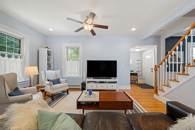 37 Devereux St, Marblehead, MA 01945 - living area featuring a baseboard heating unit, wood finished floors, ceiling fan, stairway, and recessed lighting