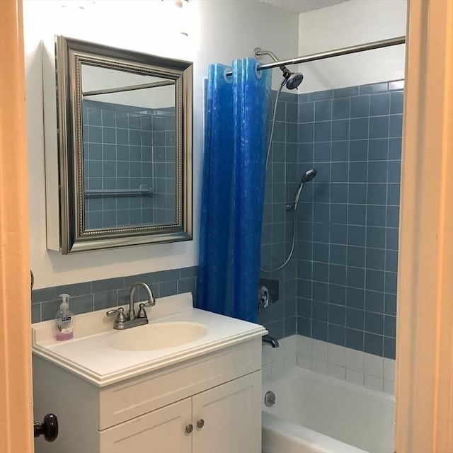 bathroom featuring vanity and shower / tub combo