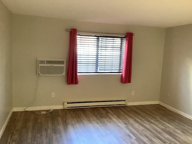 unfurnished room with hardwood / wood-style flooring, an AC wall unit, and baseboard heating