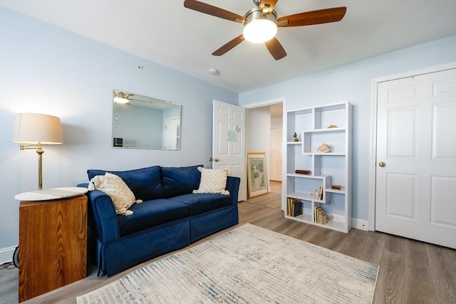 211 Central St Unit A305, Norwood, MA 02062 - living area featuring wood finished floors and ceiling fan