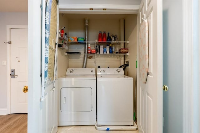 211 Central St Unit A305, Norwood, MA 02062 - laundry room with washer and dryer and light wood-style flooring