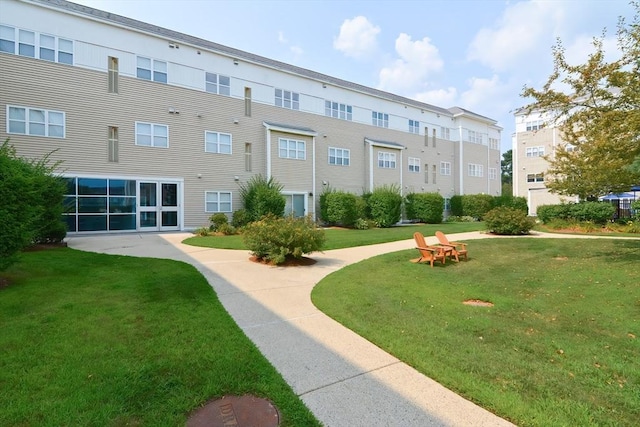 211 Central St Unit A305, Norwood, MA 02062 - surrounding community with a lawn