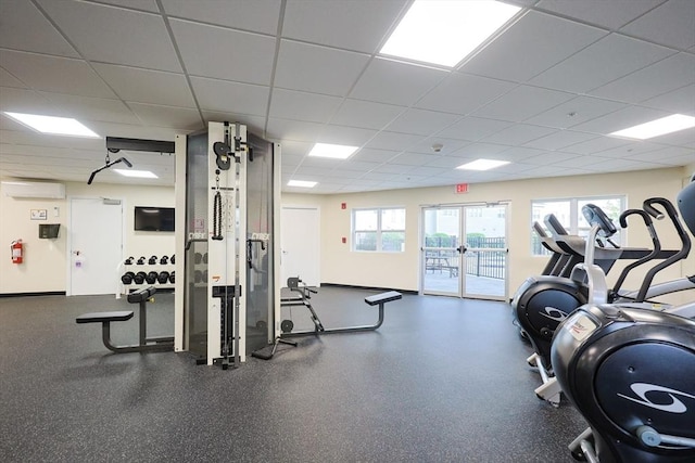 211 Central St Unit A305, Norwood, MA 02062 - workout area with a paneled ceiling, healthy amount of natural light, and a wall unit AC