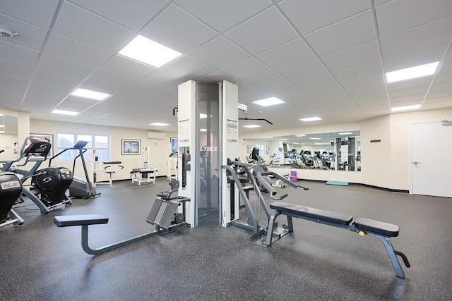 211 Central St Unit A305, Norwood, MA 02062 - workout area featuring a paneled ceiling and a wall mounted air conditioner