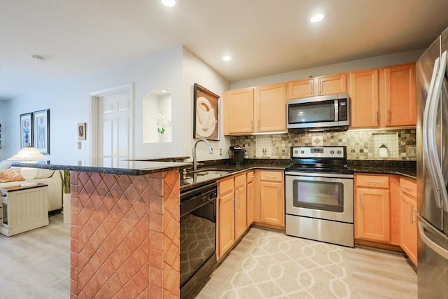 211 Central St Unit A305, Norwood, MA 02062 - kitchen featuring appliances with stainless steel finishes, light wood finished floors, light brown cabinetry, tasteful backsplash, and recessed lighting