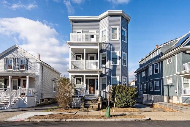 view of front of house featuring a balcony