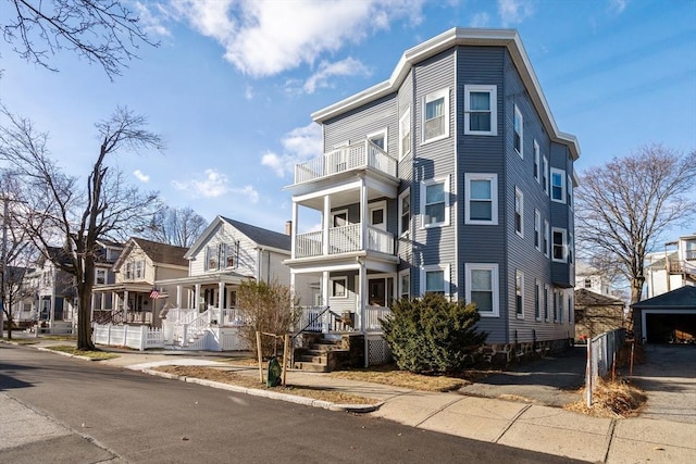 view of front of home featuring a balcony