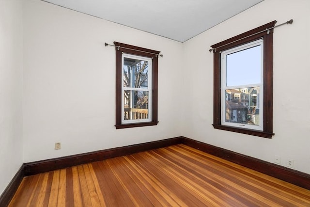 spare room with hardwood / wood-style floors