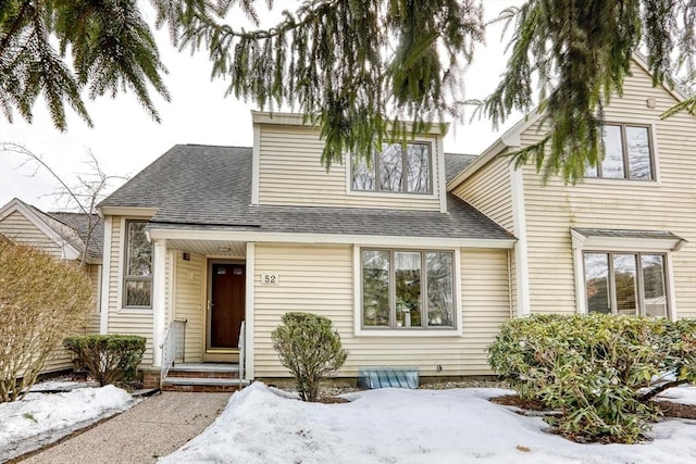 view of front of property with a shingled roof