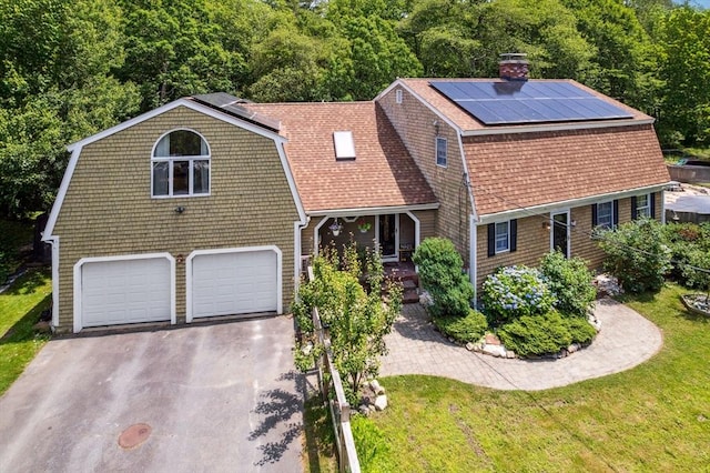 25 Brandt Beach Ave, Mattapoisett, MA 02739 - view of front of home featuring a gambrel roof, solar panels, an attached garage, driveway, and a shingled roof