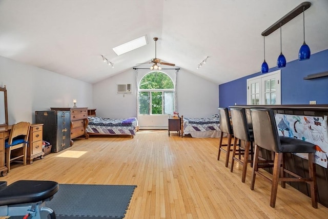 25 Brandt Beach Ave, Mattapoisett, MA 02739 - bedroom featuring wood-type flooring, a wall unit AC, lofted ceiling, and a skylight
