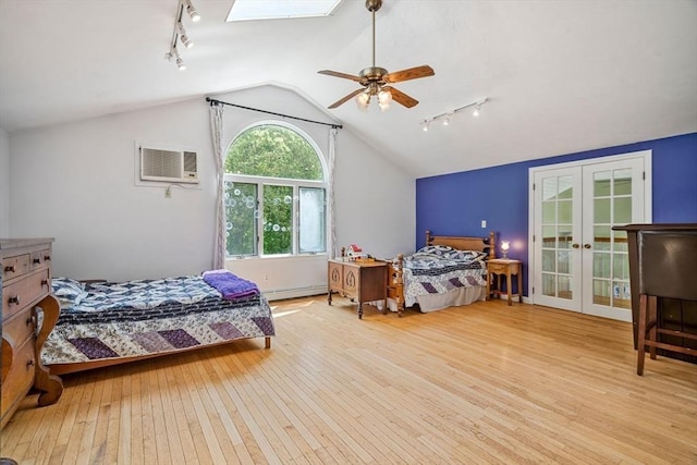 25 Brandt Beach Ave, Mattapoisett, MA 02739 - bedroom featuring rail lighting, a wall mounted AC, hardwood / wood-style flooring, vaulted ceiling, and french doors