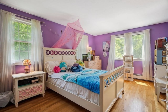 25 Brandt Beach Ave, Mattapoisett, MA 02739 - bedroom featuring wood finished floors and a baseboard heating unit