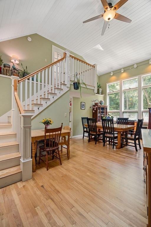 25 Brandt Beach Ave, Mattapoisett, MA 02739 - dining area featuring vaulted ceiling, wood finished floors, ceiling fan, and stairs