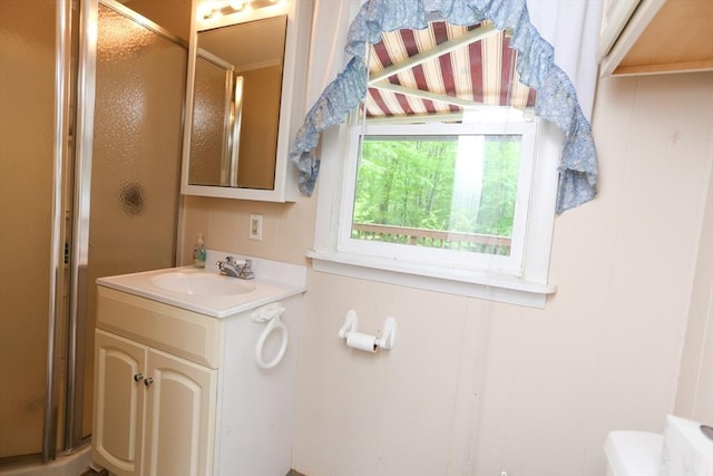 14 Cormack Rd, Sturbridge, MA 01566 - bathroom with a stall shower, vanity, toilet, and a decorative wall