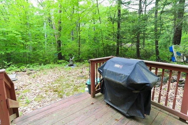 14 Cormack Rd, Sturbridge, MA 01566 - wooden deck with a grill and a view of trees