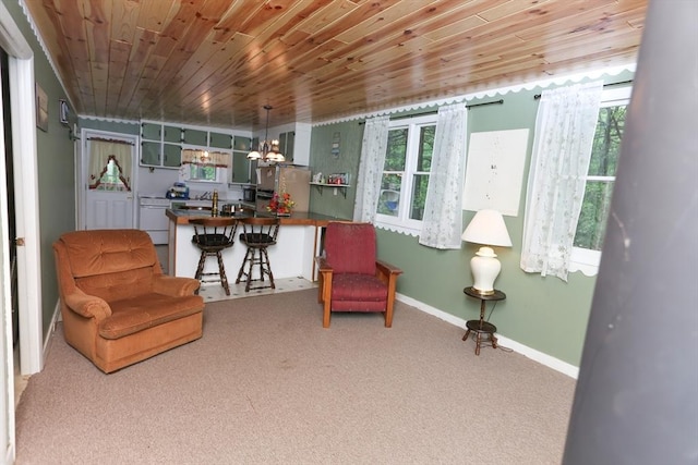 14 Cormack Rd, Sturbridge, MA 01566 - sitting room with carpet flooring, wooden ceiling, baseboards, and a chandelier