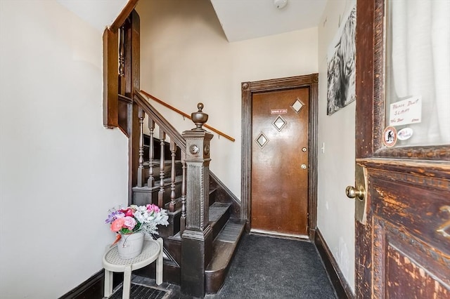 21 Sudan St, Boston, MA 02125 - carpeted entryway featuring stairway and baseboards