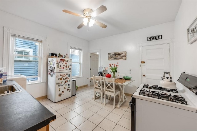 21 Sudan St, Boston, MA 02125 - kitchen with white appliances, a ceiling fan, baseboards, and light tile patterned flooring