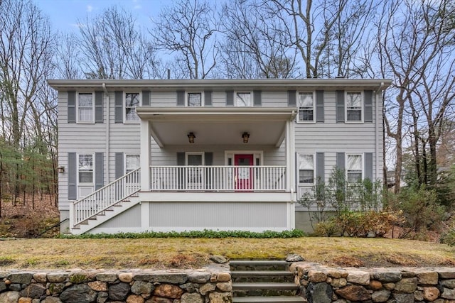 view of front of house featuring stairs and a porch