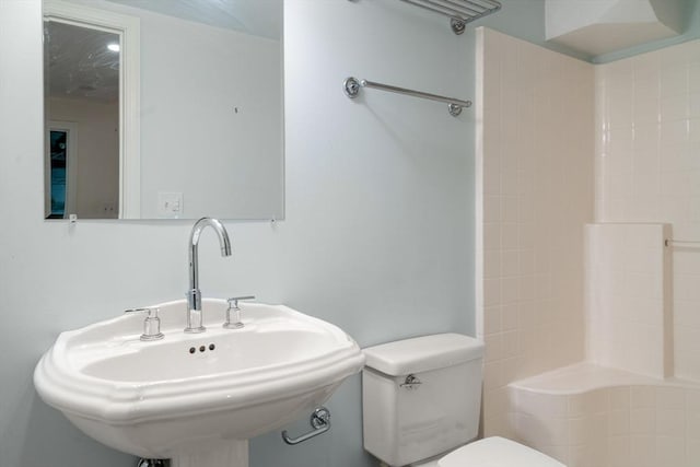 full bathroom with a sink and toilet
