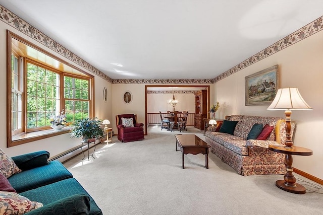 4 Clarke Rd, Littleton, MA 01460 - carpeted living area featuring a chandelier, a baseboard heating unit, and baseboards