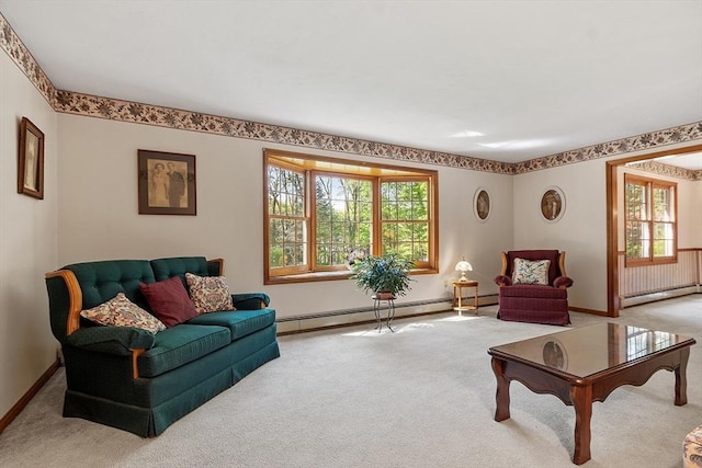 4 Clarke Rd, Littleton, MA 01460 - living area with carpet floors, a baseboard heating unit, and plenty of natural light